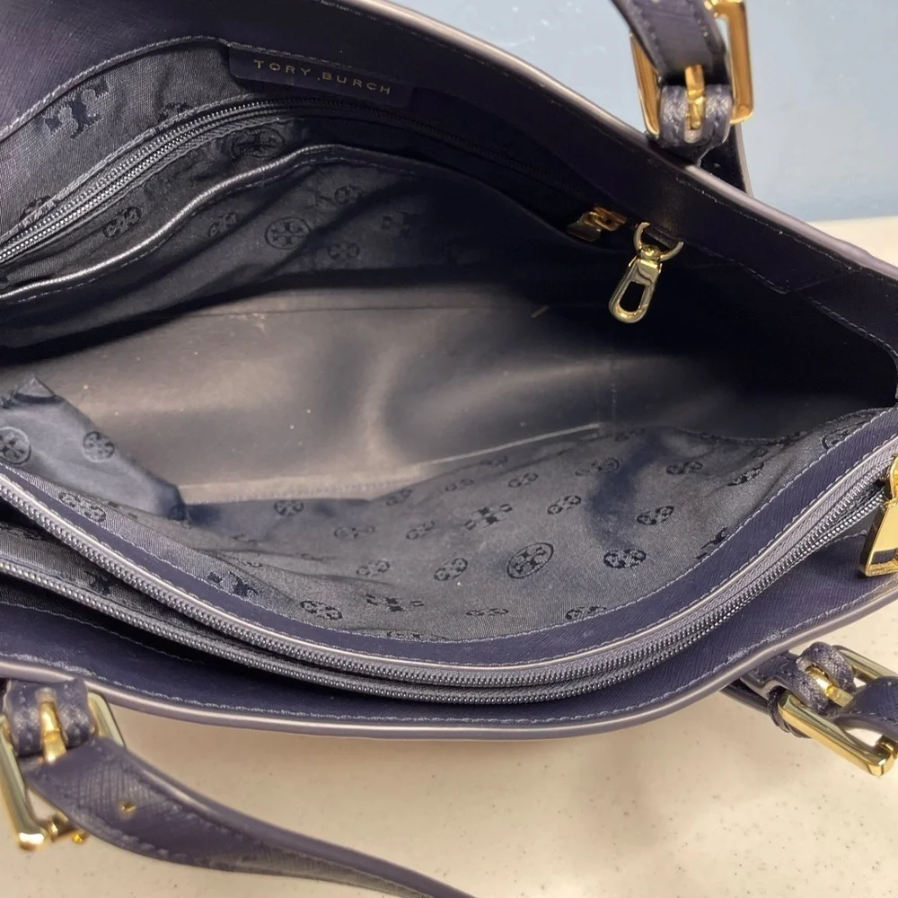 Tory Burch Saffiano leather medium Navy Blue top zip tote with material inside.